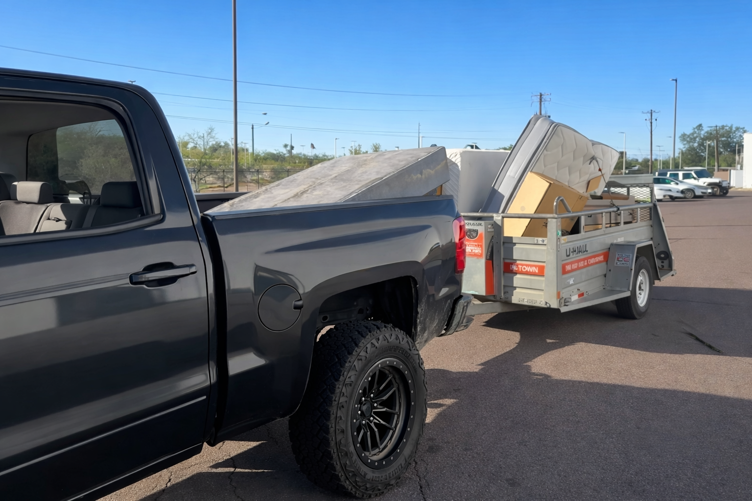 T&B Junk Removal truck with trailer full of debris